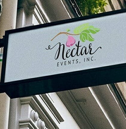 Close up of Nectar Events Inc signboard from the outside of the shop