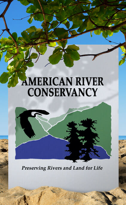 American River Conservancy- Preserving Rivers and Land for Life banner on the sand