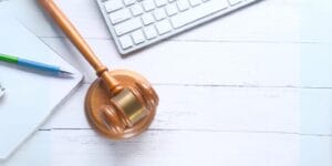 Gavel beside a laptop keyboard