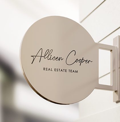 An outdoor round beige sign displaying the logo of Allicen Cooper