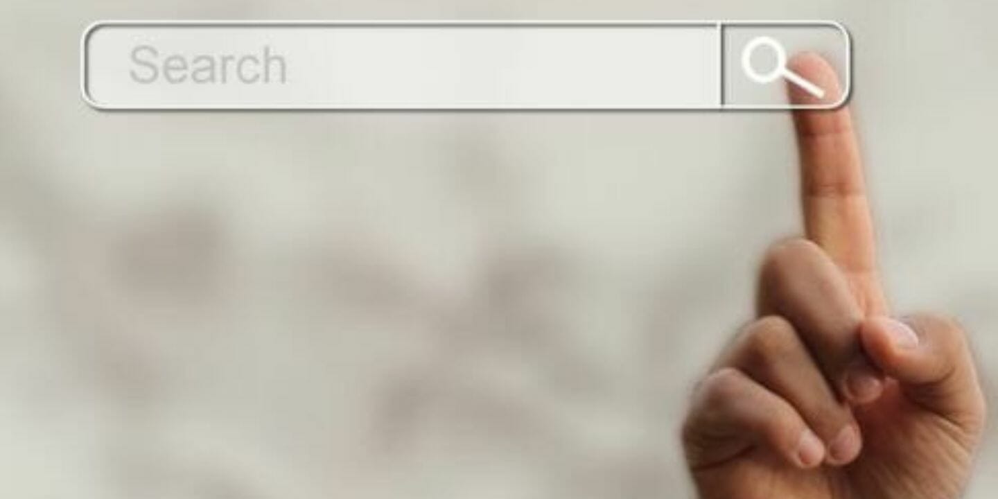 Finger pointing at a search screen